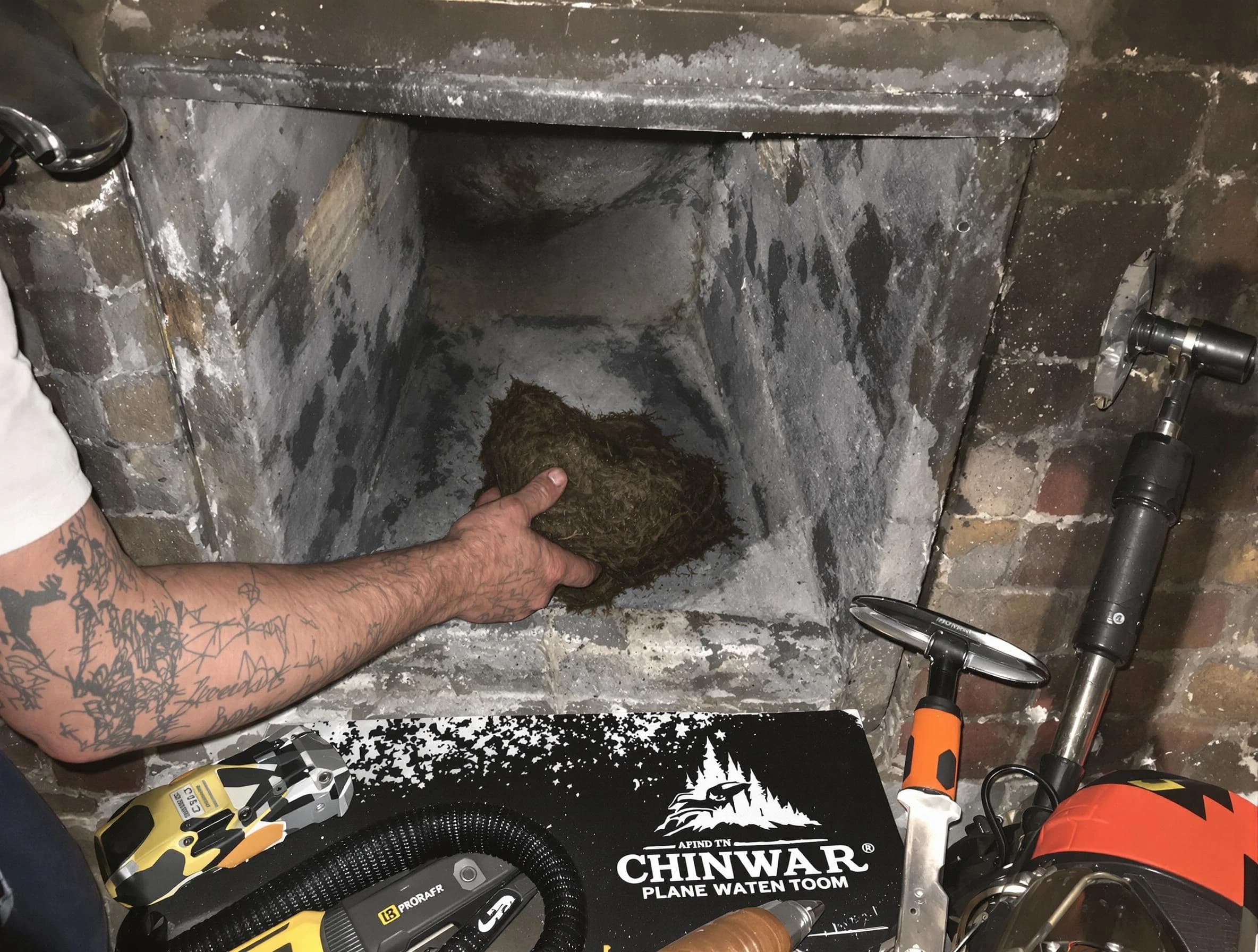 City of Orange Chimney Sweep safely removing debris and screening chimney in City of Orange, NJ